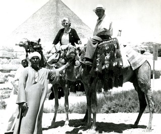 Dorothy and Theo riding camels at the Great Pyramids Giza, Egypt, circa 1950s