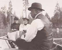 Theophilus Kirk and his daughters enjoy a row boat ride.
