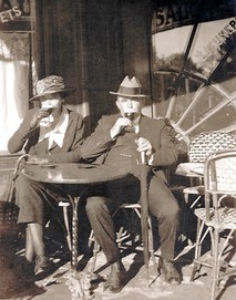 Della and William Bogen enjoy a glass of wine at a cafe in Montmartre, Paris, 1922